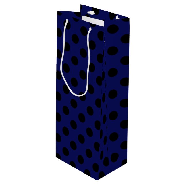 Black polka dots on navy blue wine gift bag (Front Angled)