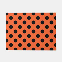 Black polka dots on orange