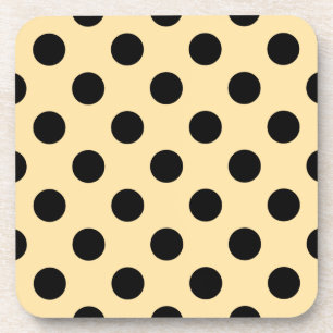 Black polka dots on pale yellow coaster