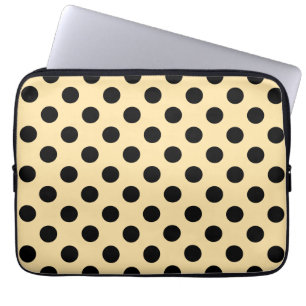 Black polka dots on pale yellow laptop sleeve