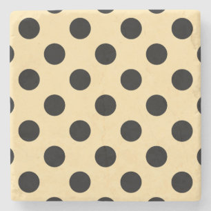 Black polka dots on pale yellow stone coaster