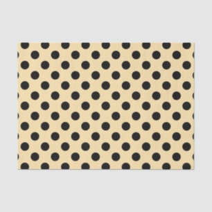 Black polka dots on pale yellow tissue paper