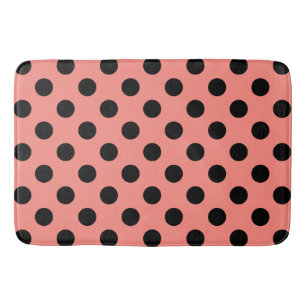 Black polka dots on peach bath mat