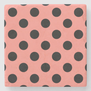 Black polka dots on peach stone coaster