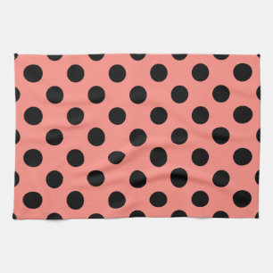 Black polka dots on peach tea towel