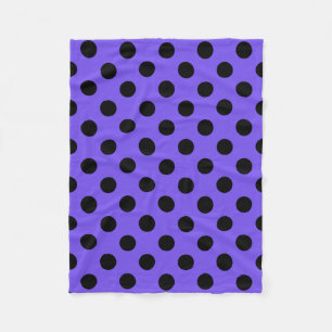 Black polka dots on periwinkle fleece blanket