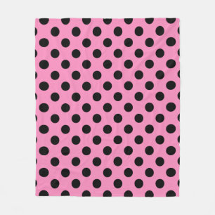 Black polka dots on pink fleece blanket
