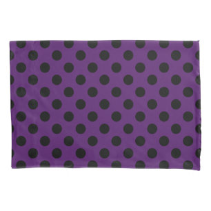 Black polka dots on plum purple pillowcase