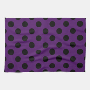 Black polka dots on plum purple tea towel