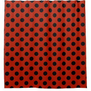 Black polka dots on red shower curtain