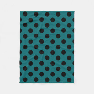 Black polka dots on teal fleece blanket