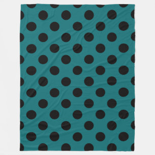 Black polka dots on teal fleece blanket