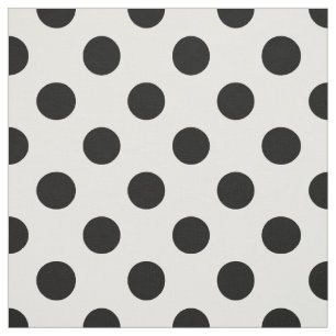 Black polka dots on white fabric