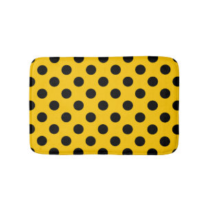Black polka dots on yellow bath mat