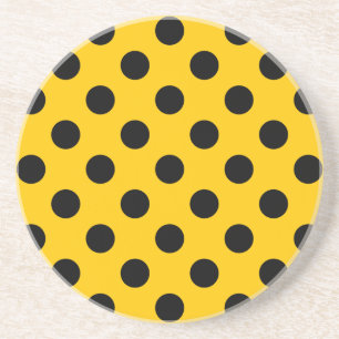 Black polka dots on yellow coaster