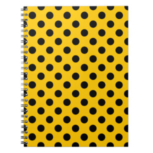 Black polka dots on yellow spiral notebook