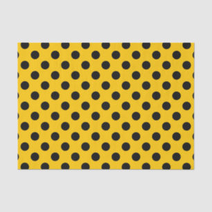 Black polka dots on yellow tissue paper