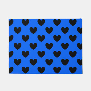 Black polka hearts on blue doormat
