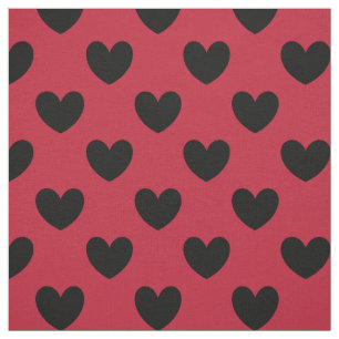 Black polka hearts on red fabric