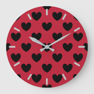 Black polka hearts on red large clock