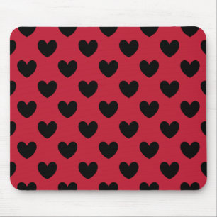 Black polka hearts on red mouse pad