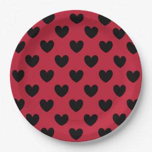 Black polka hearts on red paper plate