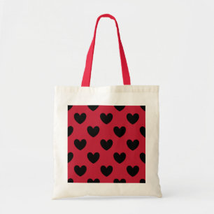 Black polka hearts on red tote bag