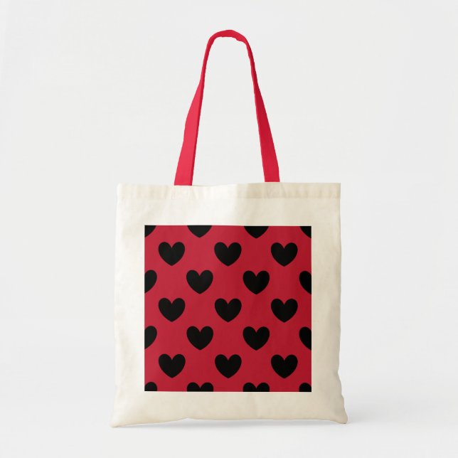 Black polka hearts on red tote bag (Front)