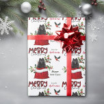 Black Pomeranian Dog in Christmas Gift Bag Wrapping Paper<br><div class="desc">The repeated pattern on this cute Christmas wrapping paper is an image of a black Pomeranian dog peeking out from a red and white Holiday gift bag. Behind him is a sprig of holly and red berries. A red and black bullfinch bird is about to land. Stylised red and black...</div>