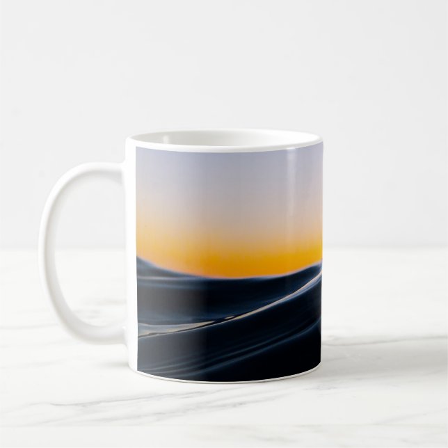 BLACK SAND UNDER ORANGE SKY DURING SUNSET COFFEE MUG (Left)