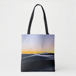 BLACK SAND UNDER ORANGE SKY DURING SUNSET TOTE BAG