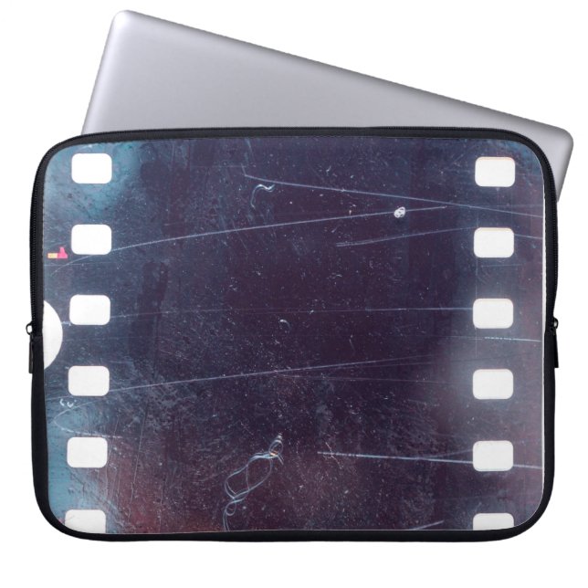 black scratched 35mm film frame, emulsion texture laptop sleeve (Front)