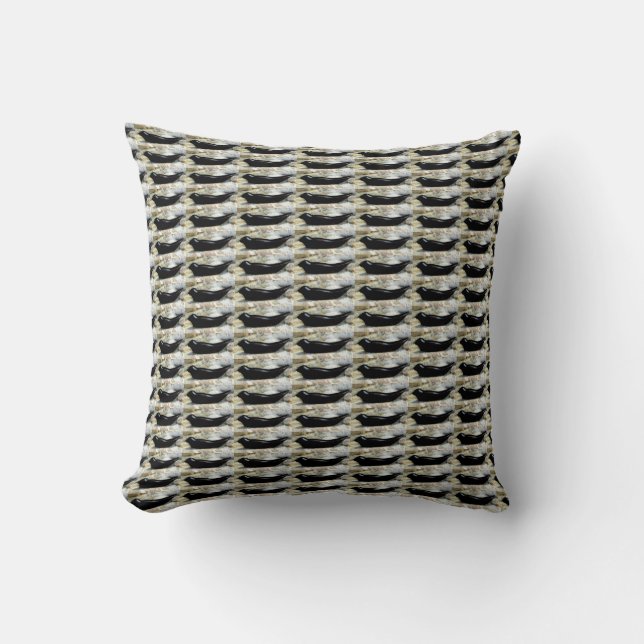 black seals on grey pillow (Front)
