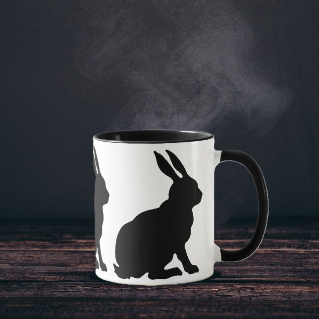 Black Silhouette Rabbits Mug (Ring of sitting black silhouette rabbits with tall ears on white coffee or tea mug.)