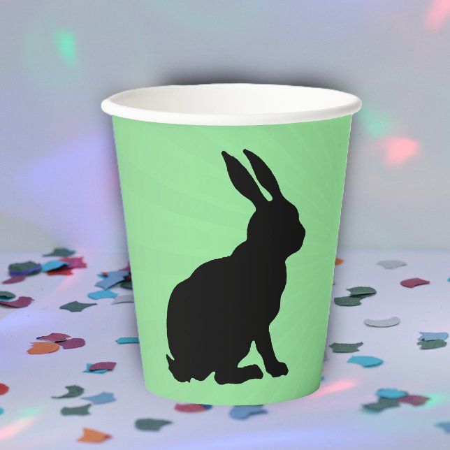 Black Silhouette Sitting Bunny Tall Ears on Green Paper Cups (Sitting black silhouette bunny rabbit on green paper party drinking cup.)