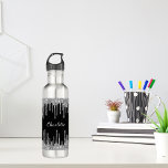 Black silver glitter drips custom monogram name 710 ml water bottle<br><div class="desc">A stylish black background with elegant faux silver glitter drips,  paint dripping look. Personalise and add your name. The name is written with a white hand lettered style script.</div>