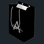 Black Silver Modern Script Girly Monogram Name Medium Gift Bag<br><div class="desc">Black and Silver Simple Script Monogram Name Gift Bag. This makes the perfect sweet 16 birthday,  wedding,  bridal shower,  anniversary,  baby shower or bachelorette party gift bag for someone that loves glam luxury and chic styles.</div>