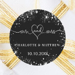 Black silver mr mrs heart wedding classic round sticker<br><div class="desc">A stylish black background,  decorated with faux silver sparkles. Mr and Mrs with a heart. Personalise and add your names and wedding date.   White text.</div>