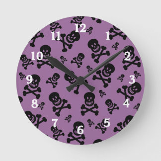 Black Skulls on Purple Background Wall Clock