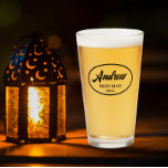 Black Stylised Wedding Best Man Name Glass<br><div class="desc">Beer glass for the wedding Best Man that features his name printed in black,  stylised script inside a black bordered oval along with wedding date. A great party supply idea for a bachelor party! Personalise your beer glass by editing and replacing name and date with your own.</div>