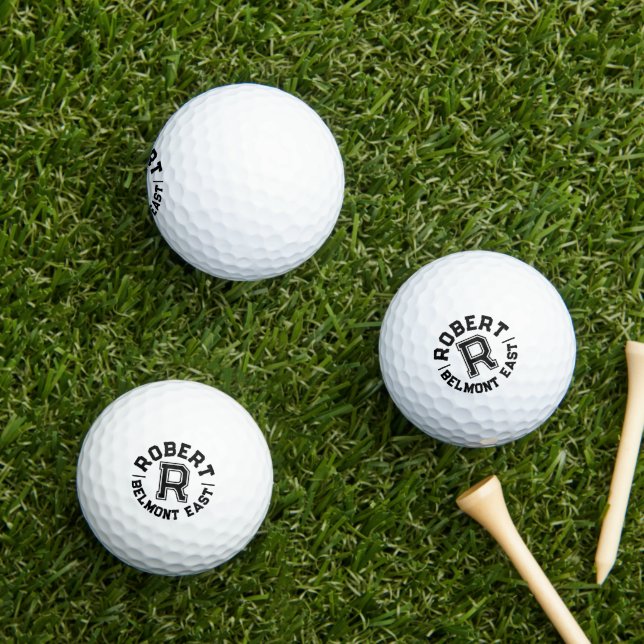 Black text sports custom monogram name and team golf balls (Insitu Grass)