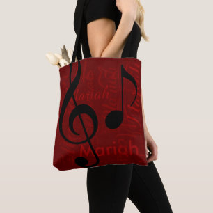 black treble clef music monogram with name red tote bag