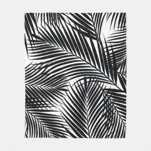 Black tropical palm leaves, white background fleece blanket