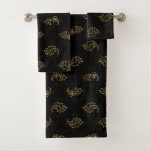 Black washcloth featuring an elegant gold baroque bath towel set