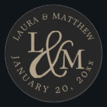 Black Wedding Monogram Classic Round Sticker<br><div class="desc">wedding  feature your initials worked into a monogram design,  joined by a decorative script ampersand. Your names and wedding date appear in white lettering,  curved around the outside.</div>