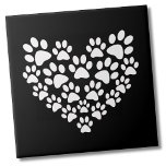Black White Paw Print Heart Tile<br><div class="desc">Use for a cute trinket gift, or get a tonne to decorate a veterinarian's office or a dog wash area of your home. You can change the background colour. This cute paw print design is great for pet lovers everywhere, featuring a heart shape made up of white paw prints against...</div>