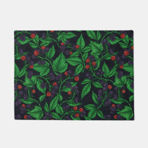 Blackberries on dark grey doormat
