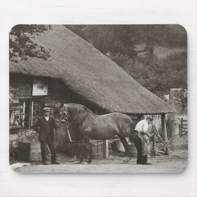 Blacksmith shoeing a horse mouse pad (Front)
