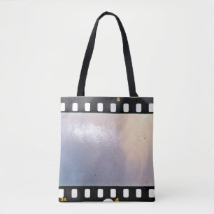 Blank 35mm film frame or strip on white background tote bag