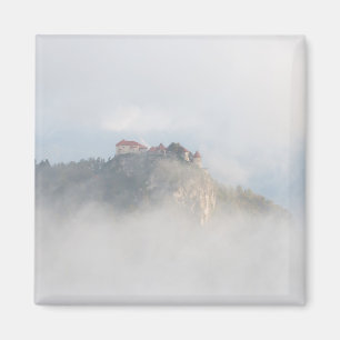 Bled castle surrounded by clouds magnet